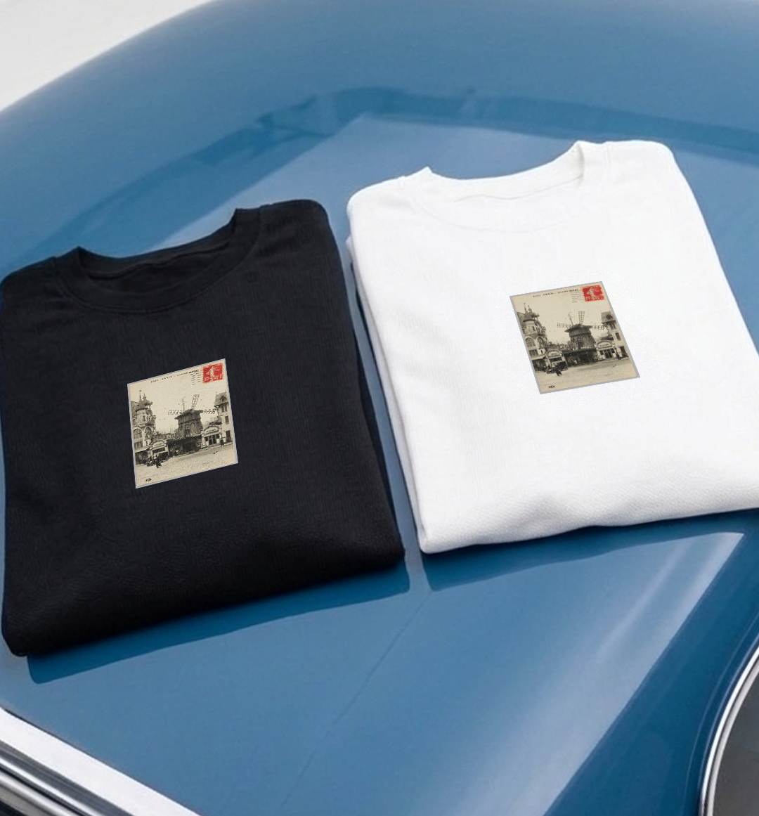 Kaiser & Schmarrn Clothing Paris souvenir collection: premium black and white tees with a vintage-style Moulin Rouge postcard print.